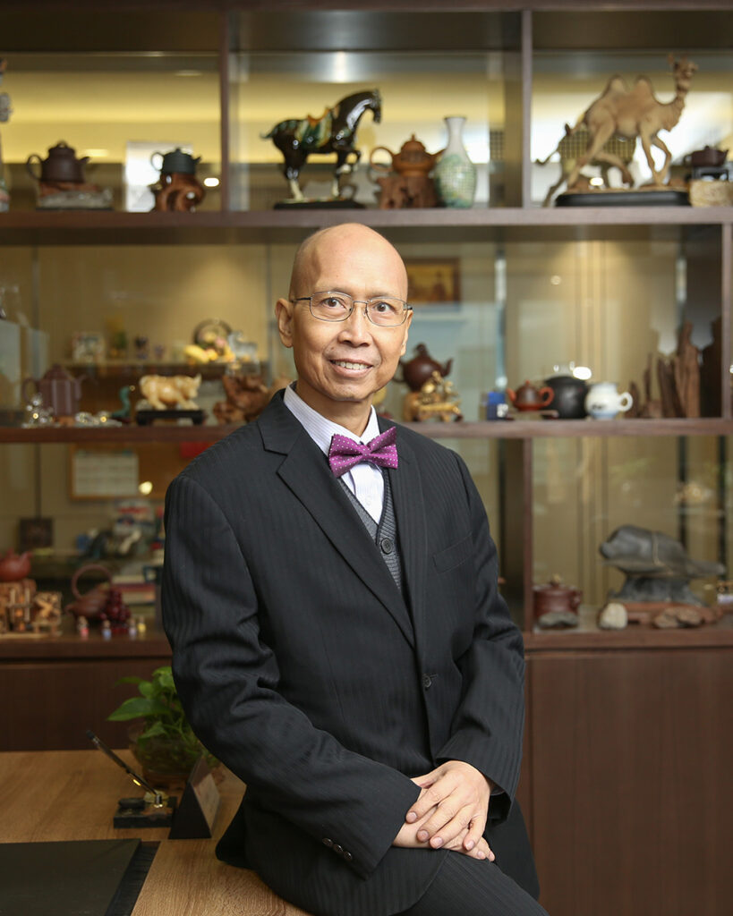 A pioneering force in the rubber industry, Mr. Sher Hing Shum, exudes expertise and determination in his profile photo, symbolizing his influential role as a leader.