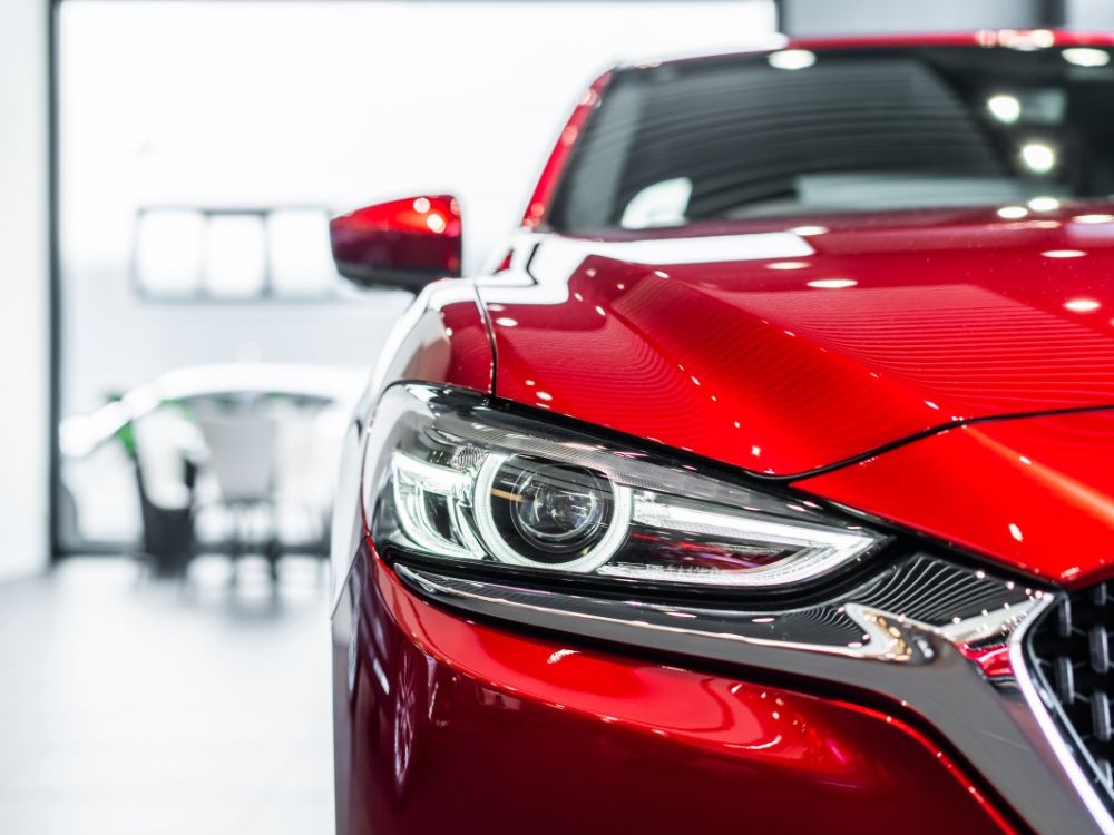 An image of a sleek red car, showcasing automotive design and engineering.